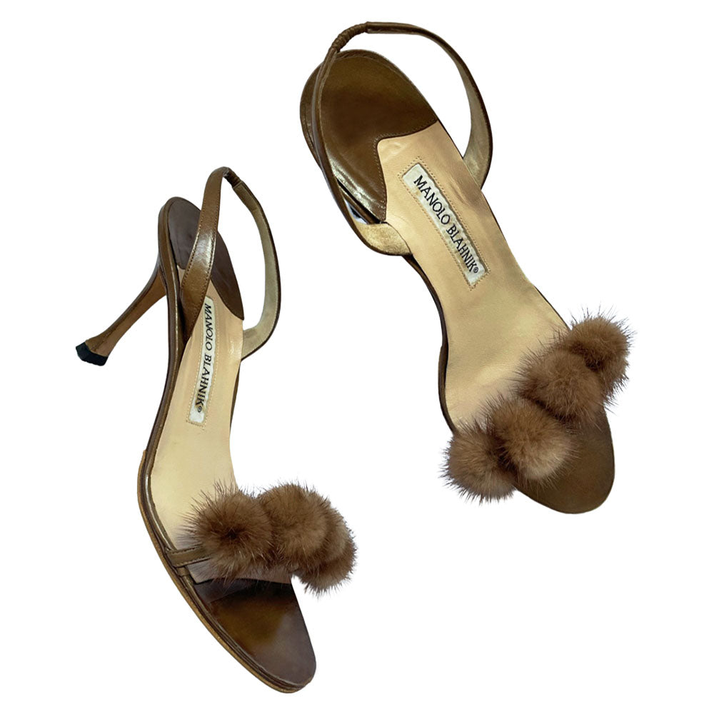 Manolo Blahnik bronze leather strappy heels with 4 mink pom-pom embellishments across the toe strap, slip-on elastic heel strap, open toe. Made in Italy