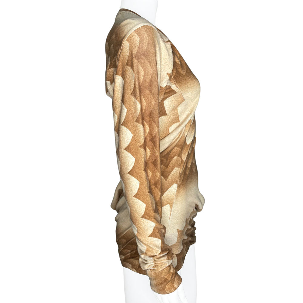 Long sleeve brown, beige and cream print V neck jersey dress by Alexander Mcqueen, circa 2010 with ruching at hips and uneven hemline. Asymmetric sleeves with three button detail at each cuff.