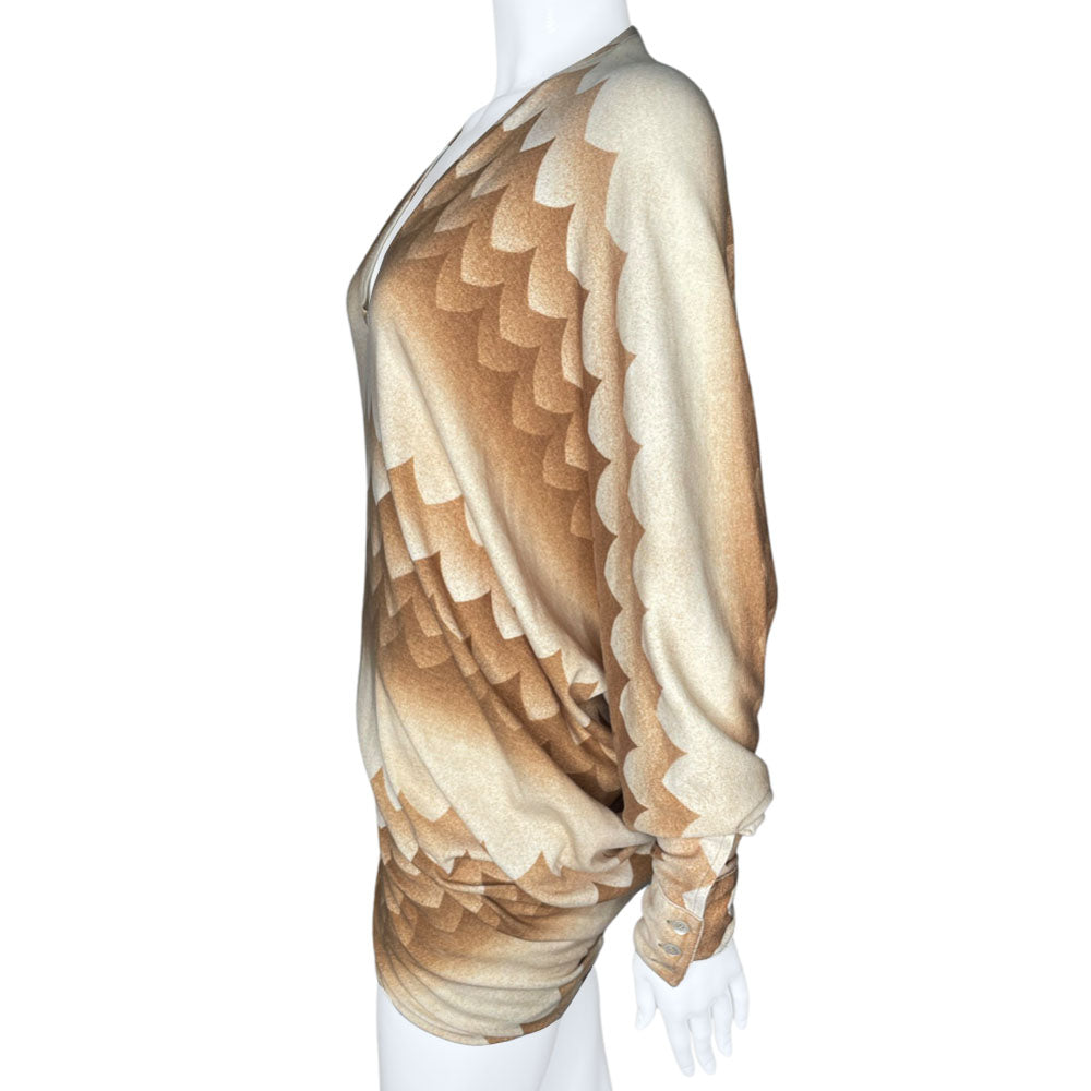 Long sleeve brown, beige and cream print V neck jersey dress by Alexander Mcqueen, circa 2010 with ruching at hips and uneven hemline. Asymmetric sleeves with three button detail at each cuff.