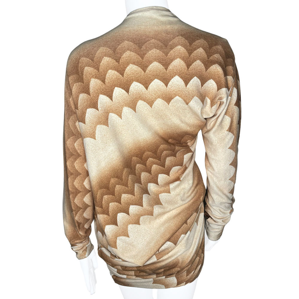 Long sleeve brown, beige and cream print V neck jersey dress by Alexander Mcqueen, circa 2010 with ruching at hips and uneven hemline. Asymmetric sleeves with three button detail at each cuff.