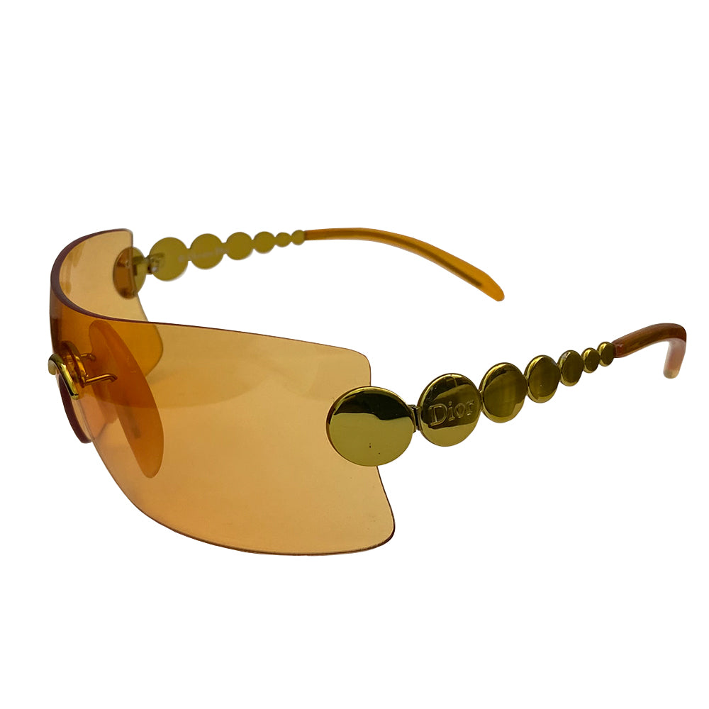 Christian Dior orange millennium sunglasses from 2001. Oversized shield lens with gold-tone hardware Dior logo engraved on arms. Excellent condition with no scratches on lens. Made in Austria.