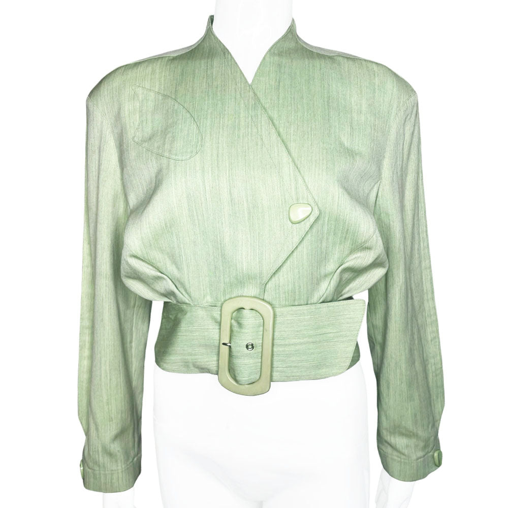Thierry Mugler 1980's seafoam green wool jacket with angled front flap featuring the iconic Mugler wave, green acetate belt and triangle buttons. Three front snap closures, two at waist and one at chest, back pleats and blouson body. Made in France