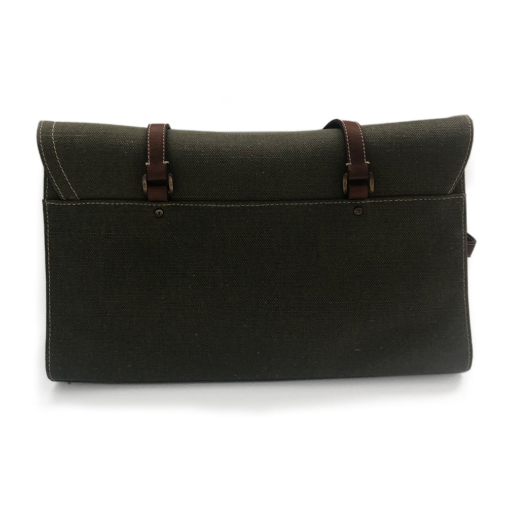Christian Dior Canvas Saddle Tote by John Galliano. Olive canvas with brown leather handles and sides with front hanging brass logo D, accent stitching throughout. CD stamped brass-tone studs and links. Magnetic button closure. Brown Dior logo satin lining, suede and leather detail and side panels, single zip interior pocket. Brass-tone metal feet.