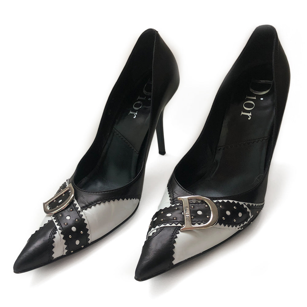 Dior D'Trick Black & White Leather D Pumps From the Spring 2004 RTW Collection By John Galliano. Perforated, scalloped leather silver D logo buckle, pointed toe. Box, dust bag and extra heel taps included. Made in Italy
