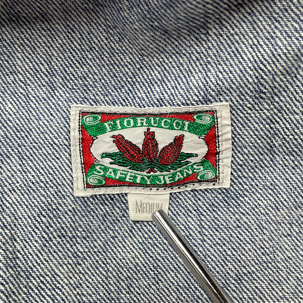 Fiorucci circa 90's high waisted flared light blue denim skirt with belt loops, front pockets with rivets, zip fly front closure with metal engraved logo button at top Fiorucci angel logo patch at back waist.
