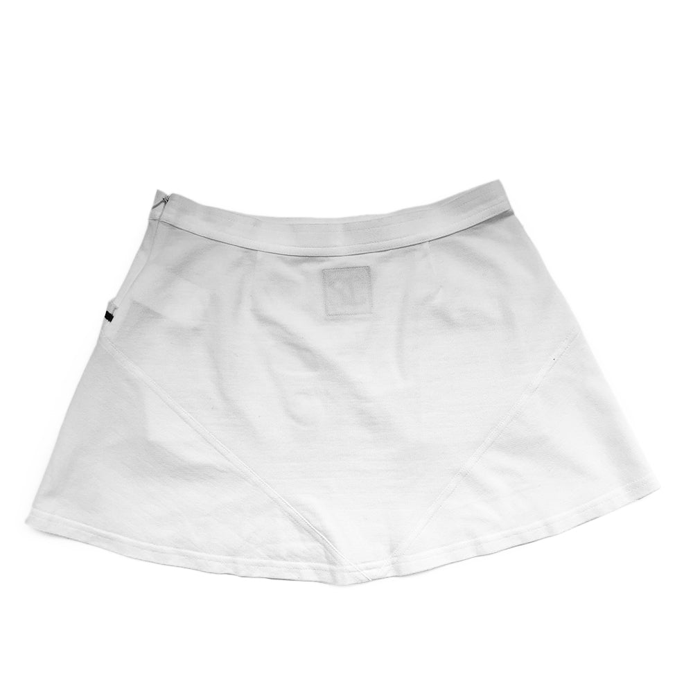 Chanel white tennis skirt, black accents on rib knit front pockets, pique polo fabric, front CC logo