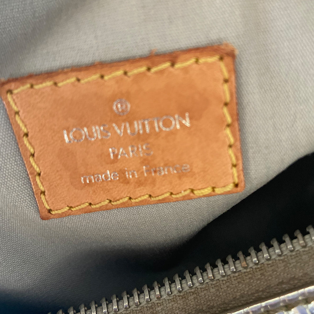 Louis Vuitton Miroir Papillon limited Marc Jacobs for Louis Vuitton, FW runway 2006. Brilliant silver-tone monogram mirrored vinyl body, 2 mirrored flat leather top handles & trim, exterior slip pocket at one end, top zipper closure, mirrored leather zipper pull, grey canvas interior. Date code: MB1016. Made in France