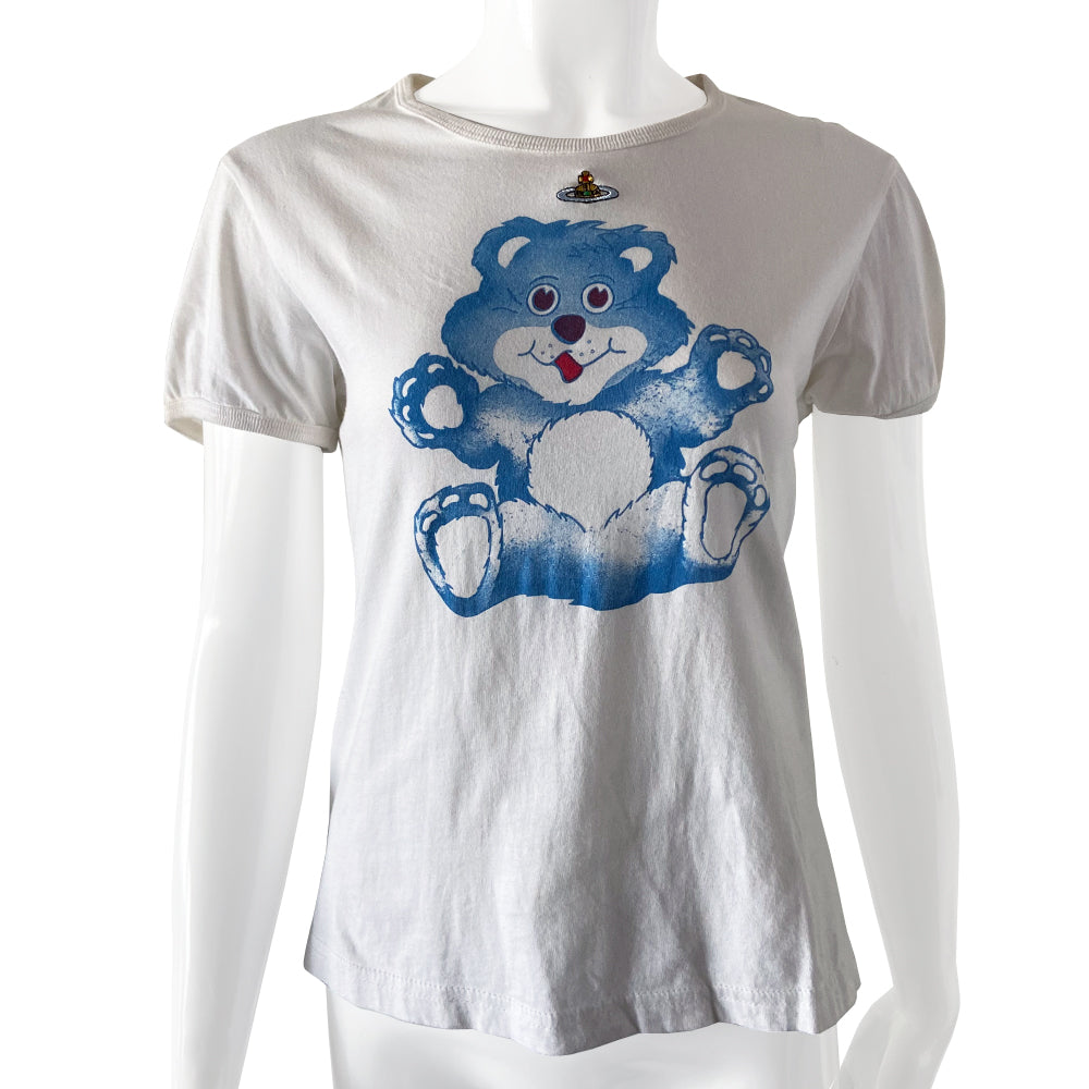 Vivienne Westwood teddy bear tee circa 1990’s Gold Label collection. Short sleeves with rounded neckline and side slits. Blue teddy bear printed at front center with floating embroidered signature logo orb.