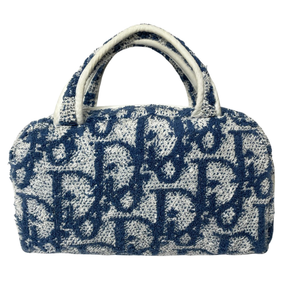 Christian Dior navy monogram terry towel mini boston bag circa 2005 with No. 2 white appliqué in front, white piping on handles and zipper. Waterproof vinyl interior with 2 slip pockets Zipper closure with white textile ribbon zipper pull.