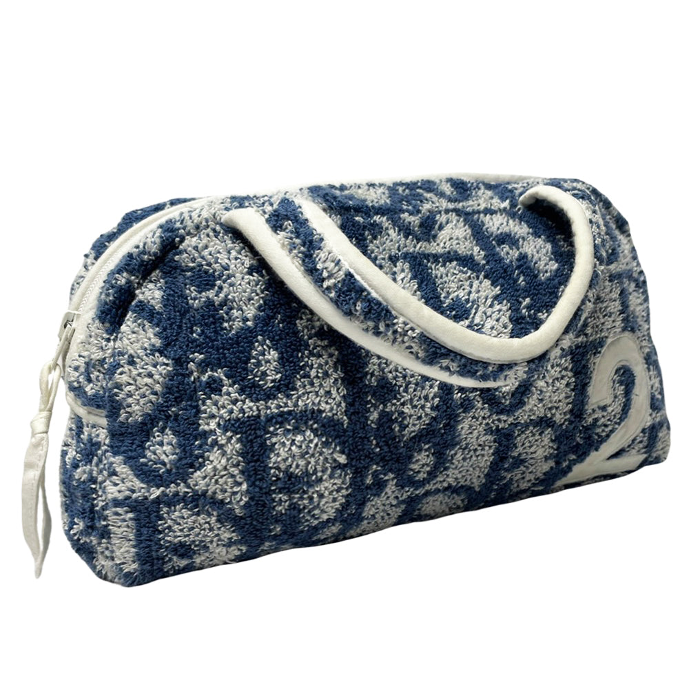 Christian Dior navy monogram terry towel mini boston bag circa 2005 with No. 2 white appliqué in front, white piping on handles and zipper. Waterproof vinyl interior with 2 slip pockets Zipper closure with white textile ribbon zipper pull.