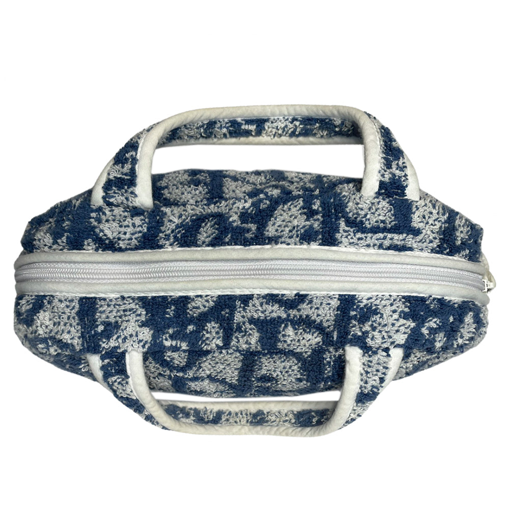 Christian Dior navy monogram terry towel mini boston bag circa 2005 with No. 2 white appliqué in front, white piping on handles and zipper. Waterproof vinyl interior with 2 slip pockets Zipper closure with white textile ribbon zipper pull.