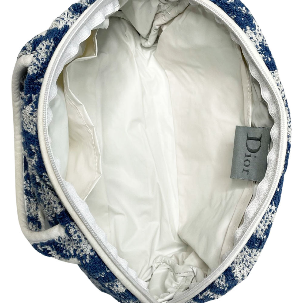 Christian Dior navy monogram terry towel mini boston bag circa 2005 with No. 2 white appliqué in front, white piping on handles and zipper. Waterproof vinyl interior with 2 slip pockets Zipper closure with white textile ribbon zipper pull.