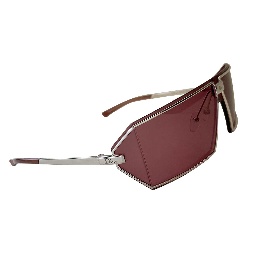 Christian Dior purple Troika sunglasses circa 1990’s. Futuristic style rectangular shape silver-tone frame and lens that wrap around to the side with Dior etched logo in center and silver-tone arms with etched Dior logos at temples. Made in Austria