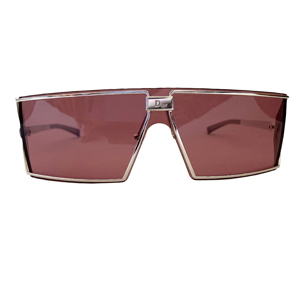 Christian Dior purple Troika sunglasses circa 1990’s. Futuristic style rectangular shape silver-tone frame and lens that wrap around to the side with Dior etched logo in center and silver-tone arms with etched Dior logos at temples. Made in Austria
