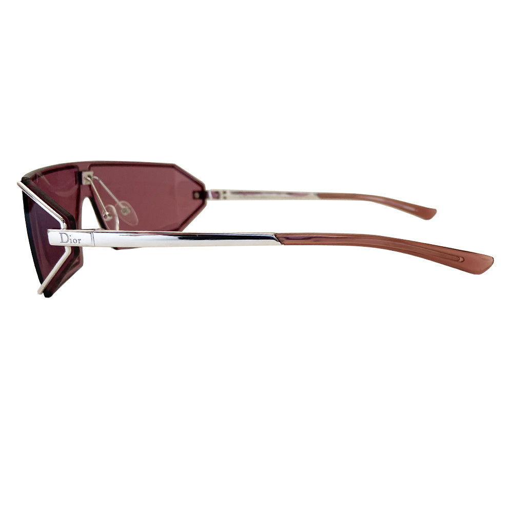 Christian Dior purple Troika sunglasses circa 1990’s. Futuristic style rectangular shape silver-tone frame and lens that wrap around to the side with Dior etched logo in center and silver-tone arms with etched Dior logos at temples. Made in Austria