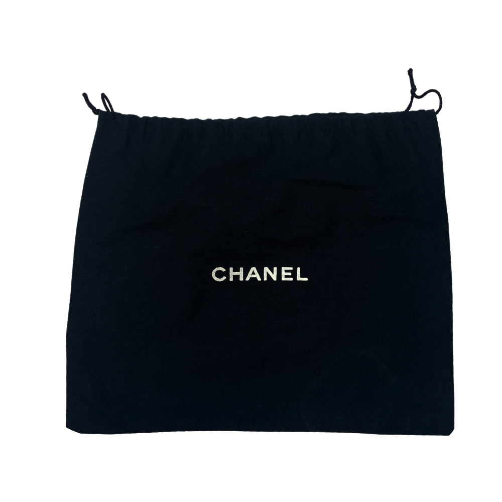 Chanel American Flag canvas and lamb leather pochette by Karl Lagerfeld for Chanel 2002/2003 with navy leather CC applique on white canvas, red leather stripes on quilted silver leather, canvas in back. Silver-tone hardware with woven leather and chain strap also acts as a zipper pull for top zip closure. Metallic silver foil vinyl lining. Made in Italy