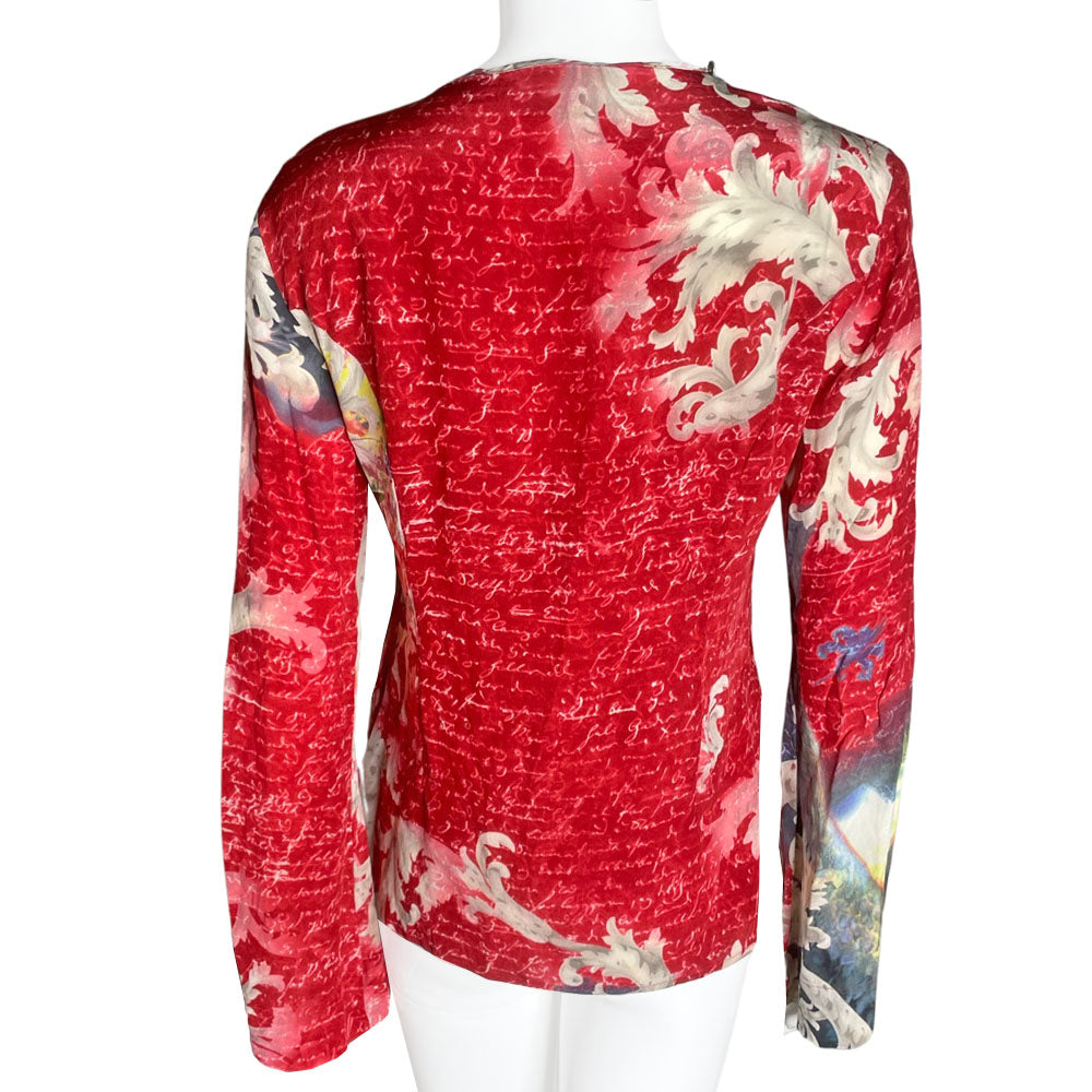 90's cult London label, Voyage long sleeve 100% silk unicorn print shirt featuring all over script print on arms and bell sleeves. Crossed lacing at front neckline, decorated with Swarovski embellished buttons around the collar.