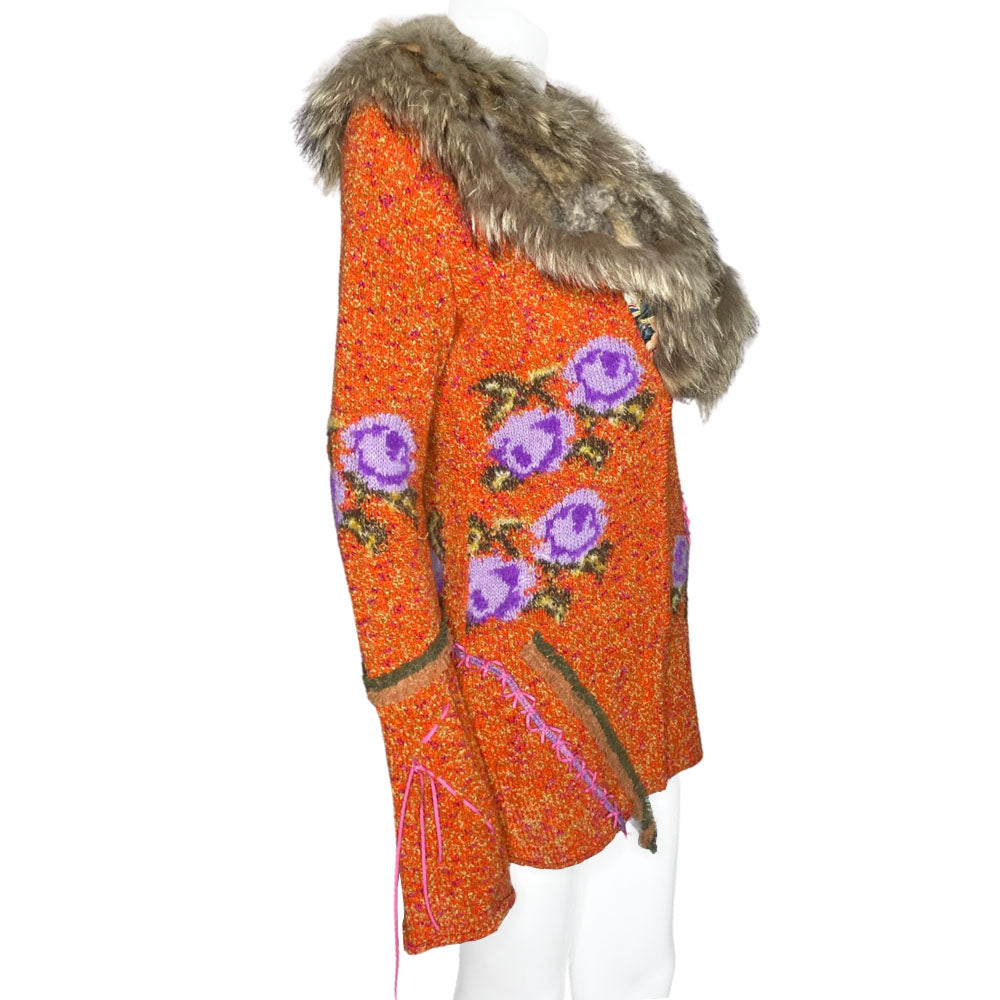 Circa 1990's from cult London label, Voyage. Orange knit body with purple and green rosebud woven print, lacing details at bell sleeves, front snap closure. Fully detachable silk lined fox fur collar.