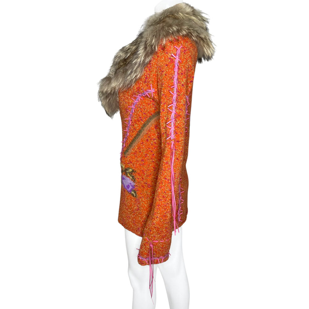 Circa 1990's from cult London label, Voyage. Orange knit body with purple and green rosebud woven print, lacing details at bell sleeves, front snap closure. Fully detachable silk lined fox fur collar.