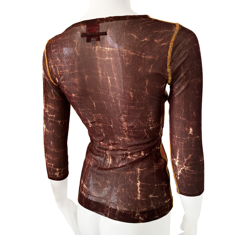 Jean Paul Gaultier Astrology mesh top by Jean Paul Gaultier Maille Classique, FW 1998. Long sleeved signature mesh fabric featuring signs of the zodiac in front Yellow accent serge stitching at arms, side seams and neckline Main Color: Brown/Multi. Made in Italy