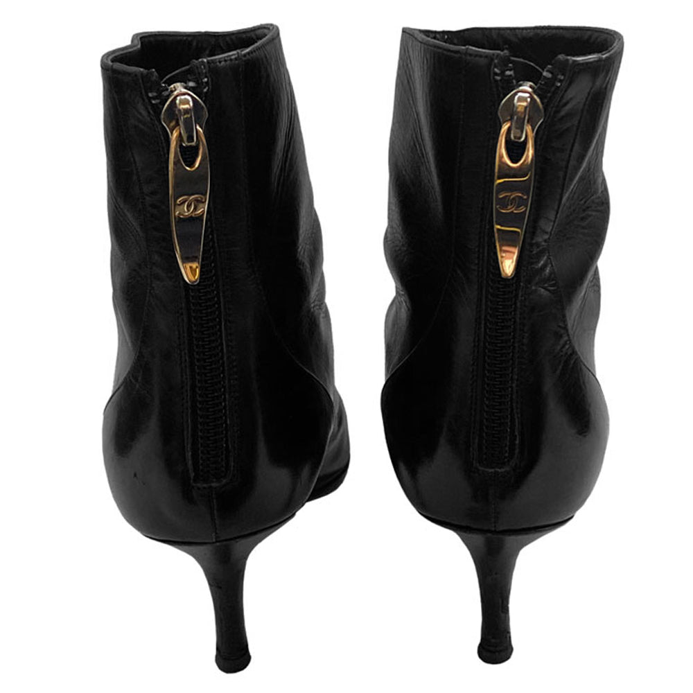 Chanel black leather CC logo short boots, Karl Lagerfeld for Chanel with pointed toe, high heels and embroidered edge mesh interlocking CC logo. Rear zipper closure with gold-tone interlocking CC logo zipper pull. Leather interior and soles Size: 36.5.  Made in Italy 