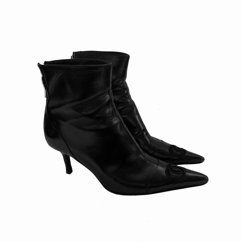 Chanel black leather CC logo short boots, Karl Lagerfeld for Chanel with pointed toe, high heels and embroidered edge mesh interlocking CC logo. Rear zipper closure with gold-tone interlocking CC logo zipper pull. Leather interior and soles Size: 36.5.  Made in Italy 