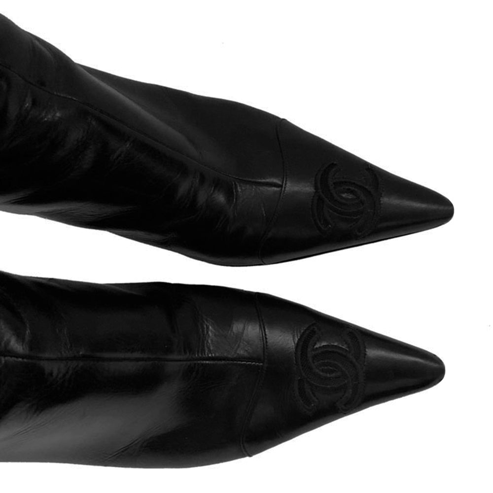 Chanel black leather CC logo short boots, Karl Lagerfeld for Chanel with pointed toe, high heels and embroidered edge mesh interlocking CC logo. Rear zipper closure with gold-tone interlocking CC logo zipper pull. Leather interior and soles Size: 36.5.  Made in Italy 