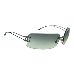 Chanel rectangular rimless sunglasses with gray gradient lenses, double wire side arms and CC metal logo at sides. Red cleaning cloth and white hard case included
