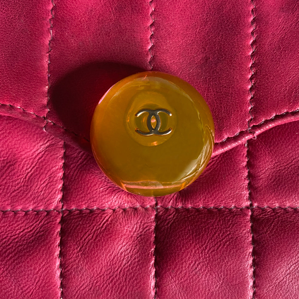 Chanel fuchsia choco quilt soft lamb double body flap bag with silver-tone metal ball chain strap and pink transluscent lucite baubles by Karl Lagerfeld for Chanel, 2000. Front bauble clasp closure with embedded silver-tone CC logo opens to dual partitioned compartments lined in tonal grosgrain, one interior zip pocket. Made in Italy