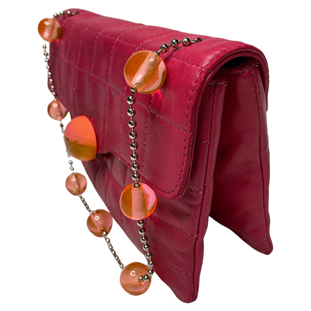 Chanel fuchsia choco quilt soft lamb double body flap bag with silver-tone metal ball chain strap and pink transluscent lucite baubles by Karl Lagerfeld for Chanel, 2000. Front bauble clasp closure with embedded silver-tone CC logo opens to dual partitioned compartments lined in tonal grosgrain, one interior zip pocket. Made in Italy