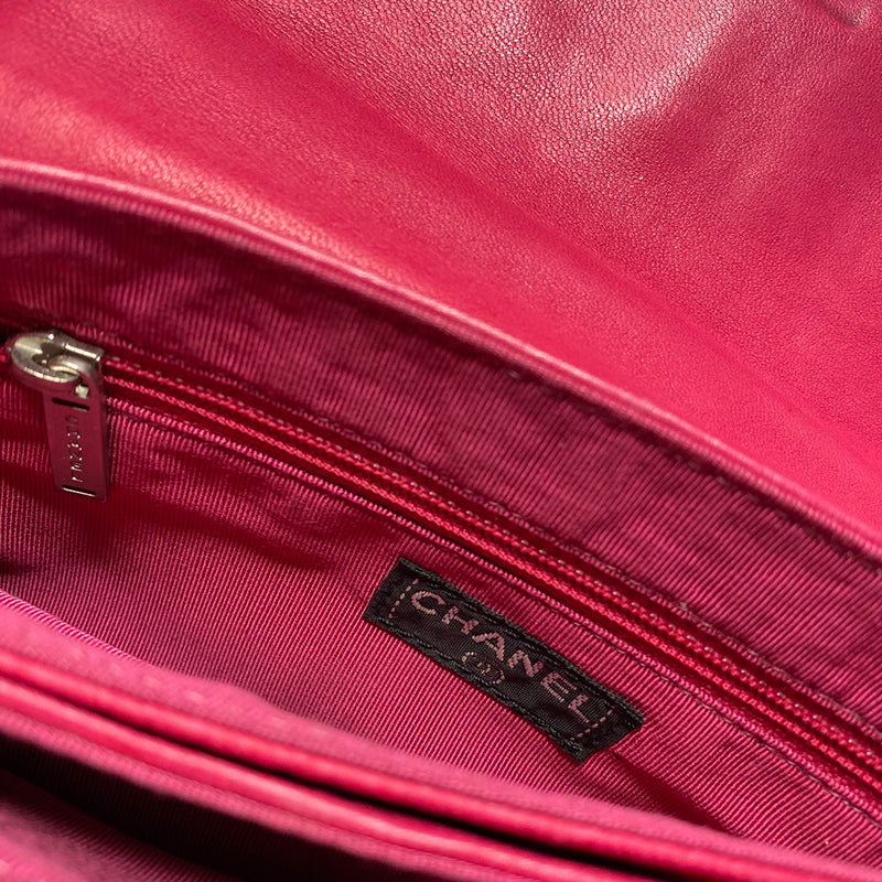 Chanel fuchsia choco quilt soft lamb double body flap bag with silver-tone metal ball chain strap and pink transluscent lucite baubles by Karl Lagerfeld for Chanel, 2000. Front bauble clasp closure with embedded silver-tone CC logo opens to dual partitioned compartments lined in tonal grosgrain, one interior zip pocket. Made in Italy
