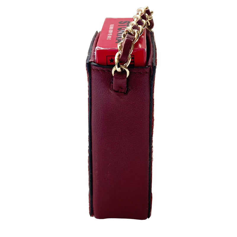 Chanel burgundy pony & lamb leather cigarette case by Karl Lagerfeld for Chanel, circa 2000-2002. Open top mini pouch with CHANEL and interlocking chain design engraved into the  pony hair panel on one side, red contrast stitching. Intertwined leather with gold-tone chain. Chanel logo interior stamp. Made in Italy 