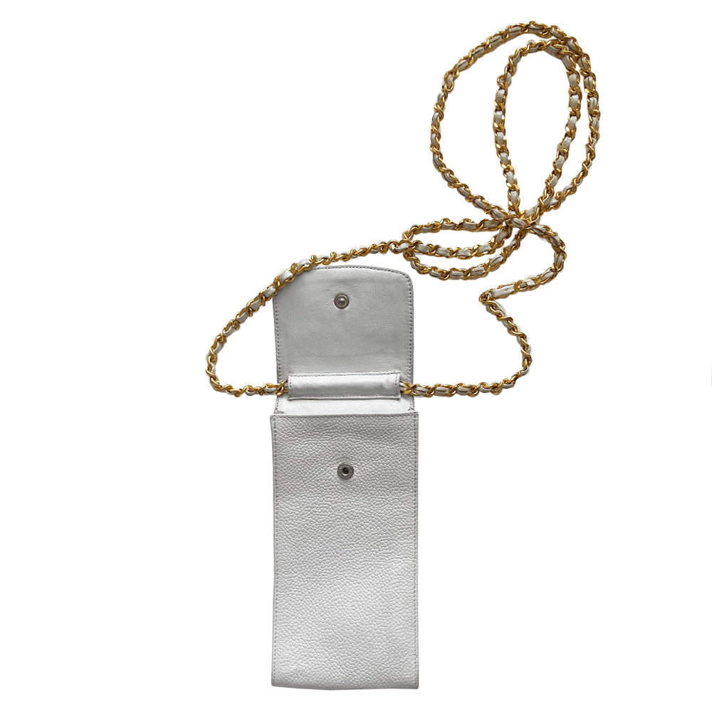 Chanel white caviar mini cross body cigarette/cellphone bag by Karl Lagerfeld for Chanel, circa 1994-1996 with stitched interlocking CC logo flap top with intertwined leather and gold-tone long chain strap. Chanel logo stamped inside leather interior Date code sticker intact. Made in Italy 