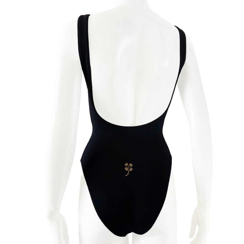 Chanel crystal appliqué embellished clover one-piece swimsuit by Karl Lagerfeld for Chanel 2001 Cruise Collection. Solid black stretch grosgrain fabric one-piece swimsuit with low back, front embellishments of tiny gold and bronze-tone appliqué crystal cc logo clovers and single logo clover in back. Size 36.  Made in France