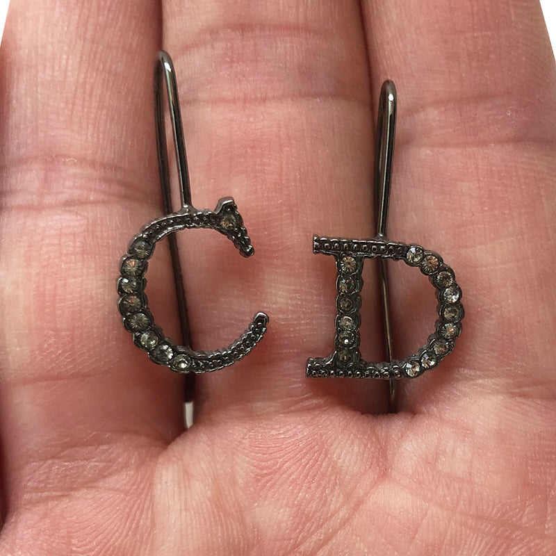 ChristianChristian Dior CD crystal letter drop Earrings with Hanging single hook that slips through ear and gunmetal-tone crystals set into the CD Letters Color: Gunmetal Drop earring design Length (cm) 3cm Width (cm) 1.5cm