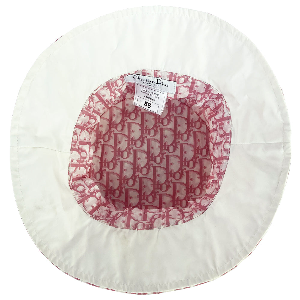 Christian Dior pink monogram bucket hat by John Galliano for Dior, 2005. Diorissimo print bucket hat with 2” brim. Tag size: 58.  Made in France. 