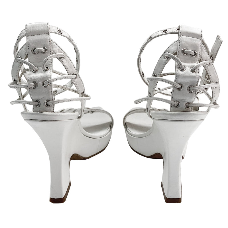Christian Dior Street Chic rare ankle strap white leather wedge sandals from spring 2003 Dior ad campaign featuring Gisele Bündchen. White leather with small platform and wedge heels and leather soles. Silver grommet details with leather laces woven through Lock and key charms at ankle straps. Made in Italy