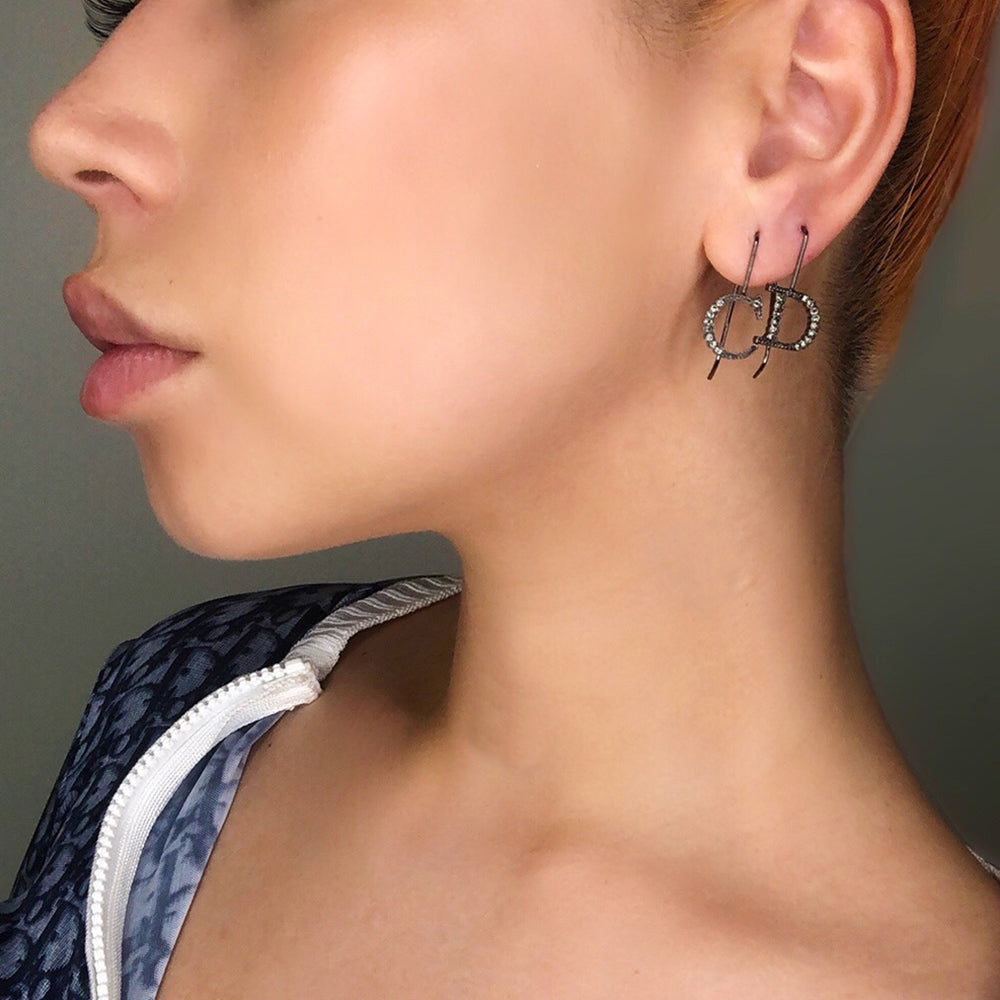 Christian Dior CD crystal letter drop Earrings with Hanging single hook that slips through ear and gunmetal-tone crystals set into the CD Letters Color: Gunmetal Drop earring design Length (cm) 3cm Width (cm) 1.5cm