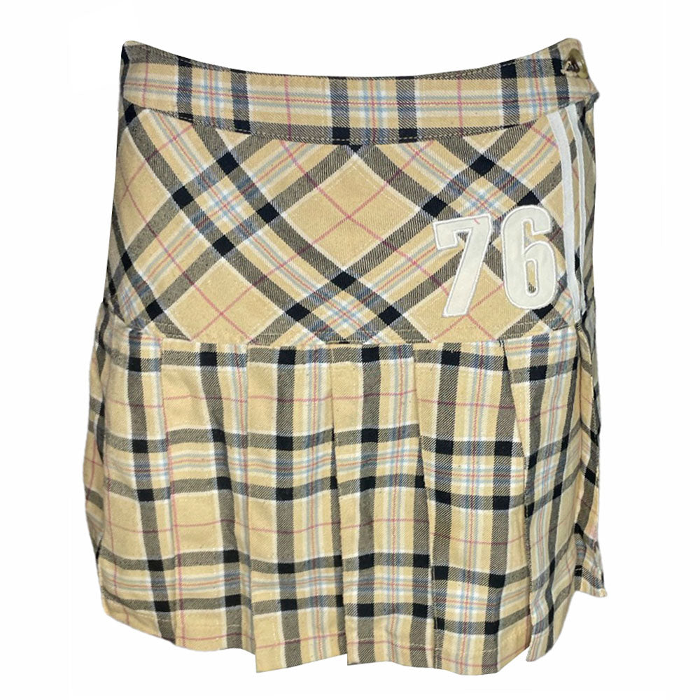 Fiorucci yellow, black, red high waisted plaid pleated flannel mini skirt, side zip with slash side pockets. White cotton appliqué 76 at hip and cursive Fiorucci logo at back waist 