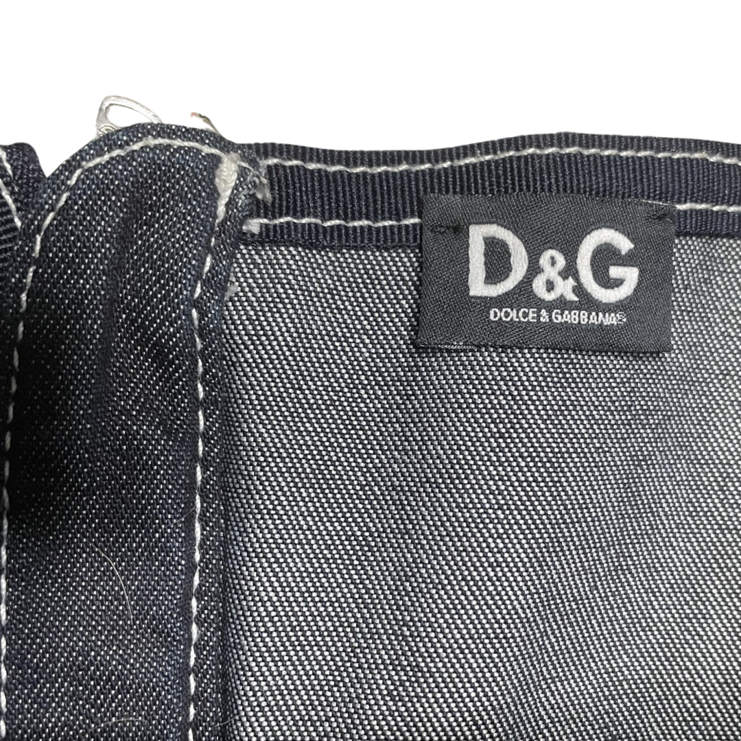 Dolce & Gabbana dark denim strapless mid-length corset dress with double criss crossed golden brown leather front lacing on bodice, white contest stitching, removable elastic straps. Exposed D&G stamped silver-tone back zipper 