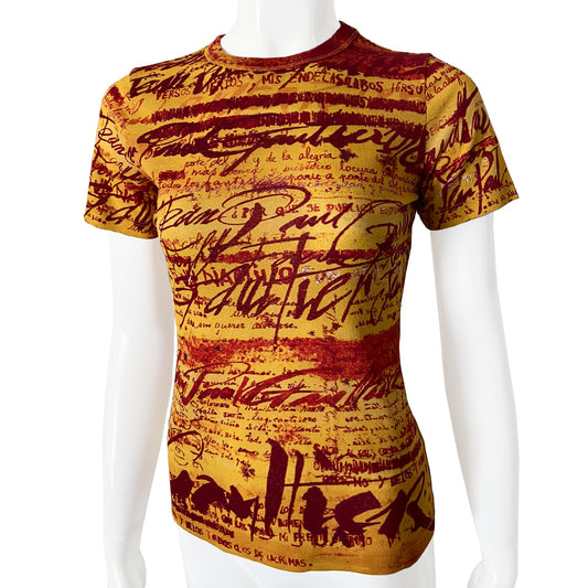 Jean Paul Gaultier yellow tight weave short sleeve mesh top Jean Paul Gaultier Femme, 1990’s featuring all over red graffiti style print. Tag size: 40 Fabric: 100% Polyamide. Made in Japan 