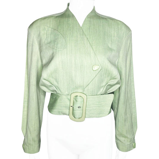 Thierry Mugler 1980's seafoam green wool jacket with angled front flap featuring the iconic Mugler wave, green acetate belt and triangle buttons. Three front snap closures, two at waist and one at chest, back pleats and blouson body. Made in France 