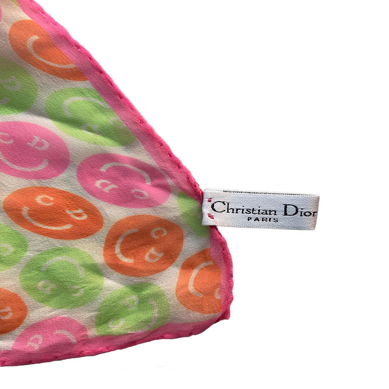 Christian Dior neon all over pink, orange and green smiley face scarf by John Galliano for Dior, Autumn 2001. Hand sewn rolled neon pink edges in 100% Habotai silk with tag attached. Made in Italy 21.5” x 21.5”