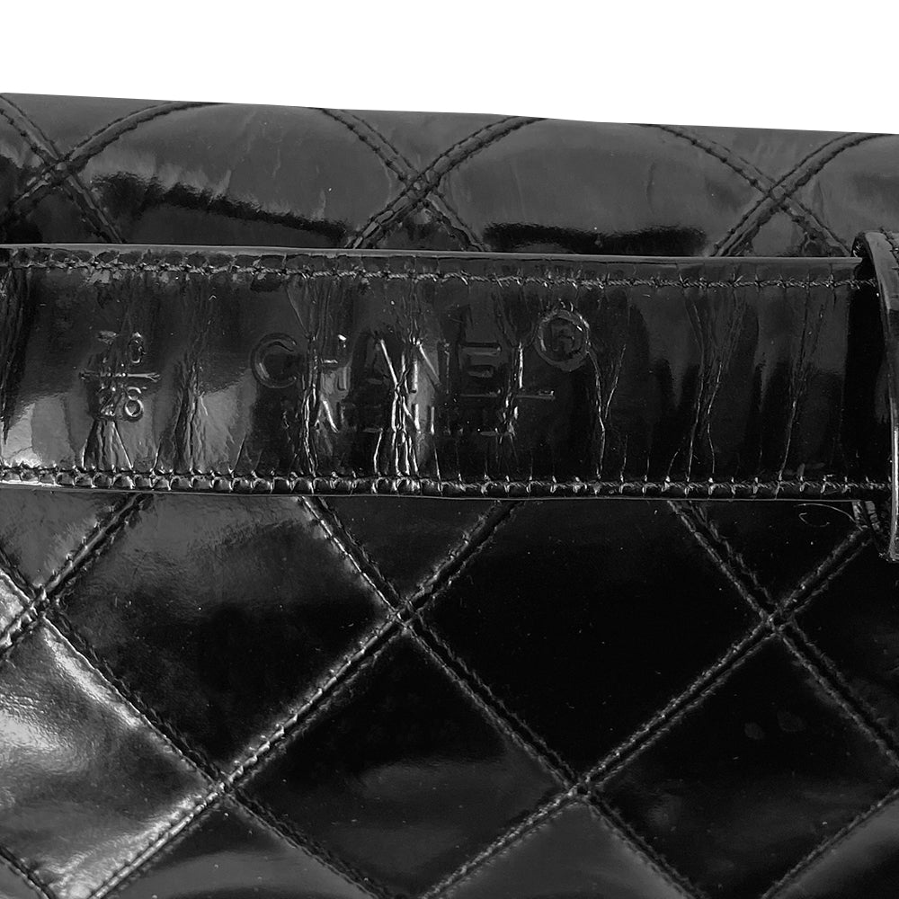 Chanel black quilted patent leather flap belt bag by Karl Lagerfeld for Chanel with gold tone turnlock closure and woven gold chain attached to adjustable belt. Black leather interior with single zip pocket. Indicated belt size: 70cm / 28 Included: Original boutique sticker and guarantee cards. Made in Italy 