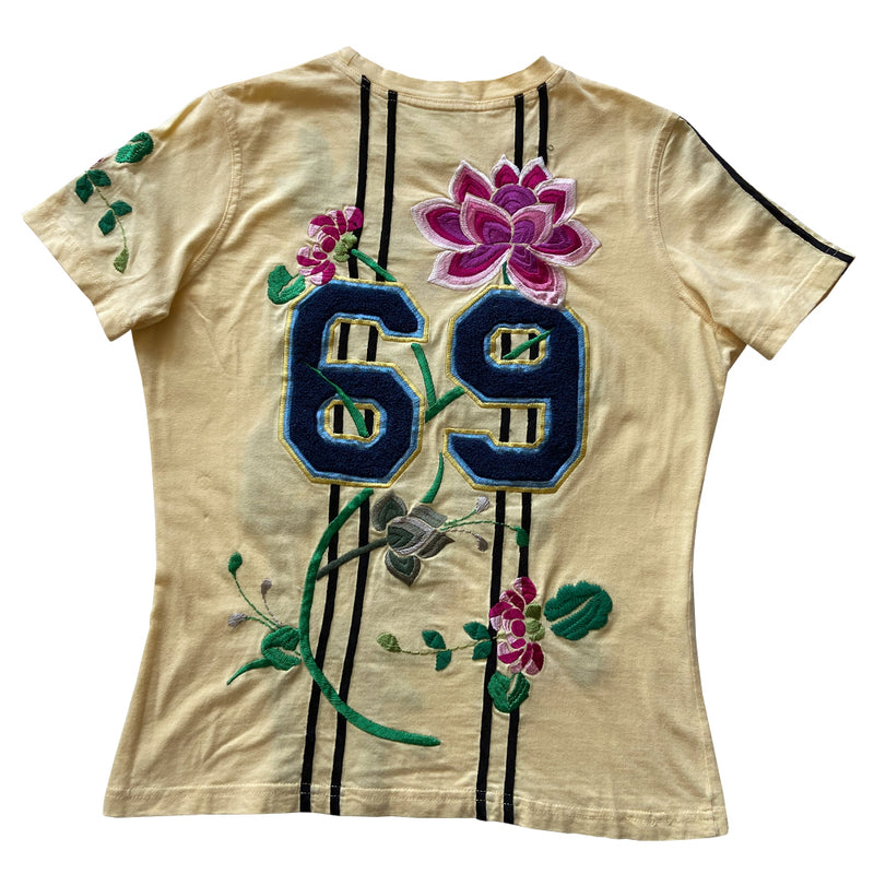 Christian Dior Adiorable 69 short sleeve yellow tee by John Galliano for Christian Dior, FW 2003 with Adiorable 69 front and back appliqué and green, pink, fuchsia  embroidered flowering fuchsia plants, koi and lily pads in front, flowers on sleeve, 2 stripes on the other.  Size: FR 42 Made in Italy 