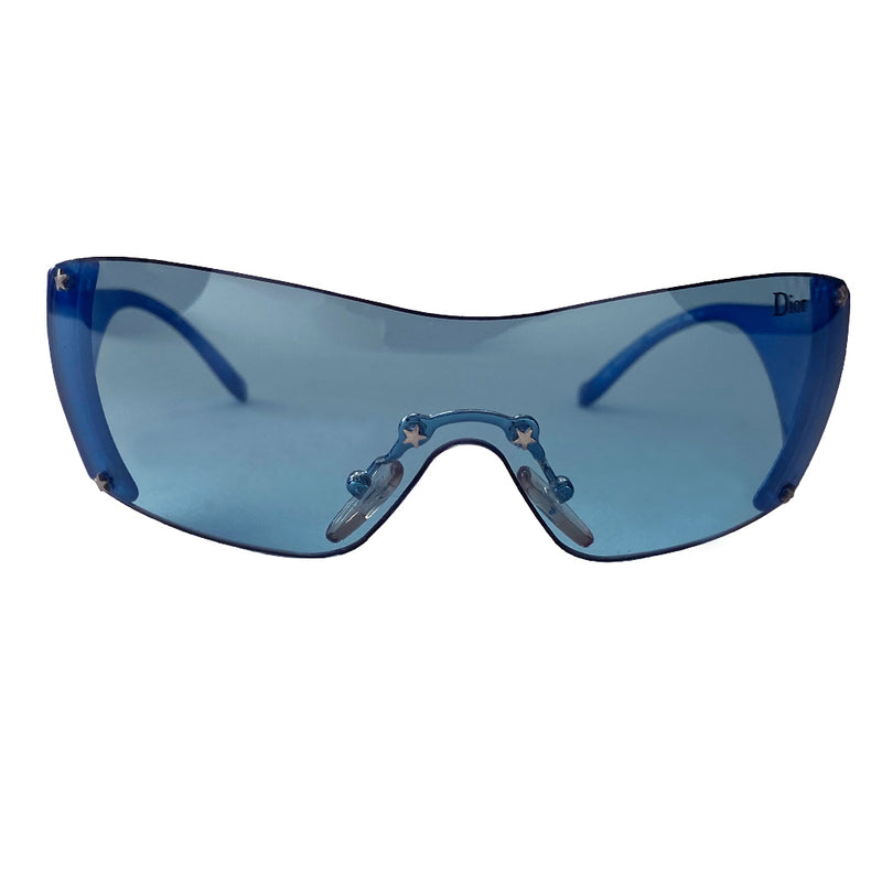 Christian Dior blue wrap around frameless Baby Dior children’s sized shield sunglasses  from John Galliano for Dior with attached non-folding arms Dior logo at temple and left side on lens with star studs at lens edges and nose piece. Case and dust cloth included. 