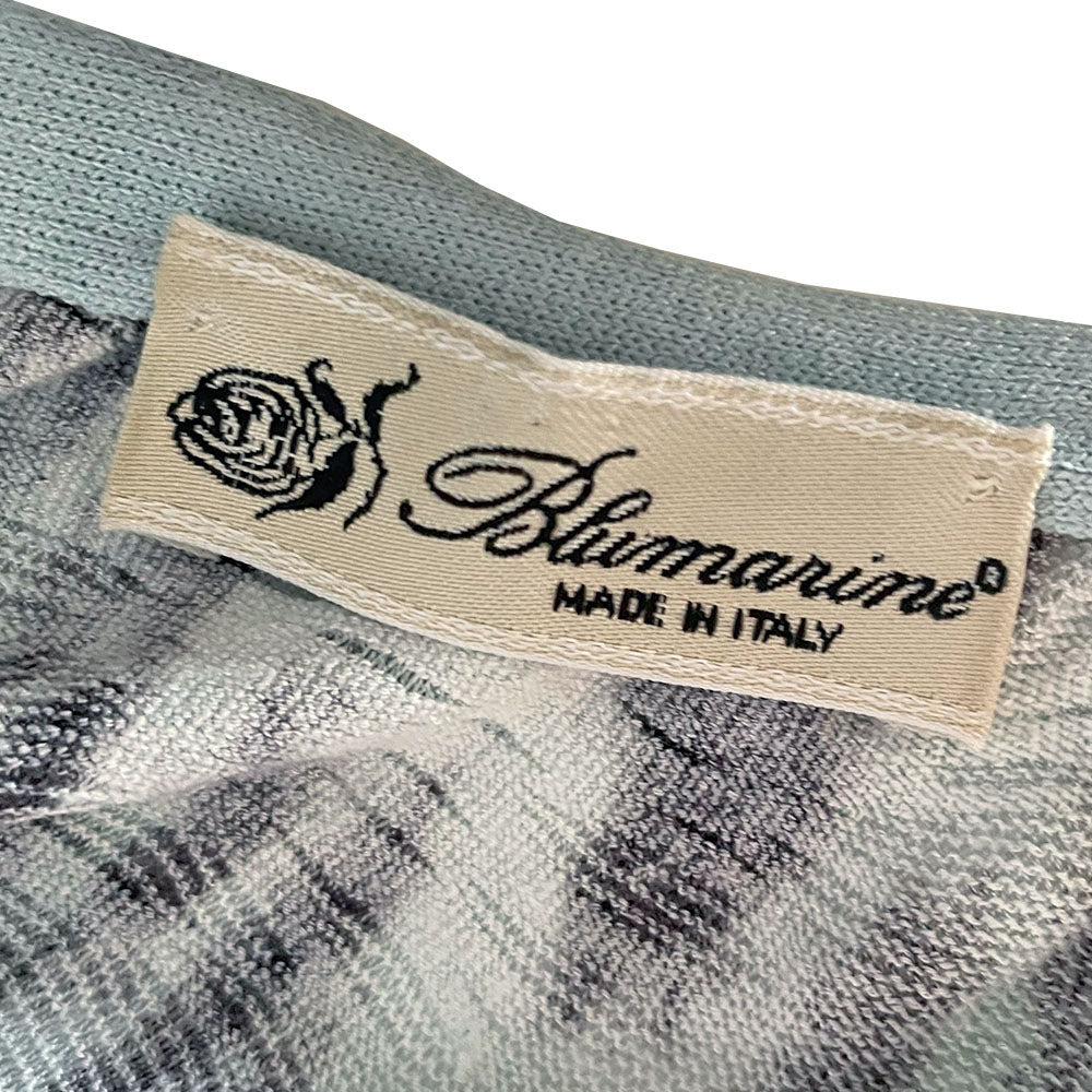 Blumarine black leopard print on pale blue background wrap knit sweater with pale blue accent edging, blue ribbon ties at waist and cuffs. Made in Italy 