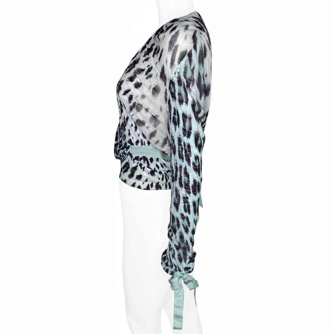 Blumarine black leopard print on pale blue background wrap knit sweater with pale blue accent edging, blue ribbon ties at waist and cuffs. Made in Italy 