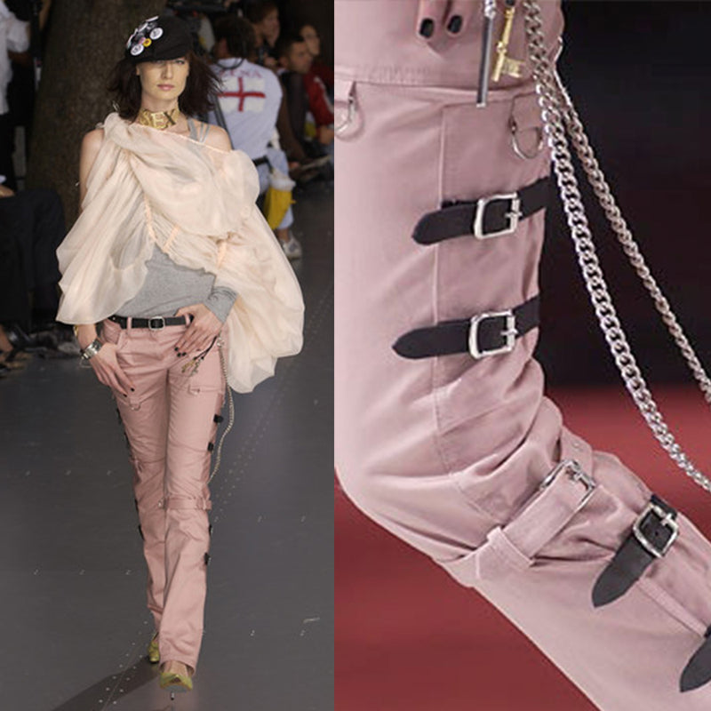D&G pink Sex Bondage Strap Pants, SS 2003 SEX runway with 2 oversized front patch pockets, silver-tone hanging D rings. Side panels feature 4 black leather straps, logo engraved buckles, single adjustable fabric strap that wraps at knee. Cargo flap pocket in back with engraved silver-tone logo button, appliqué SEX logo patch. Made in Italy 