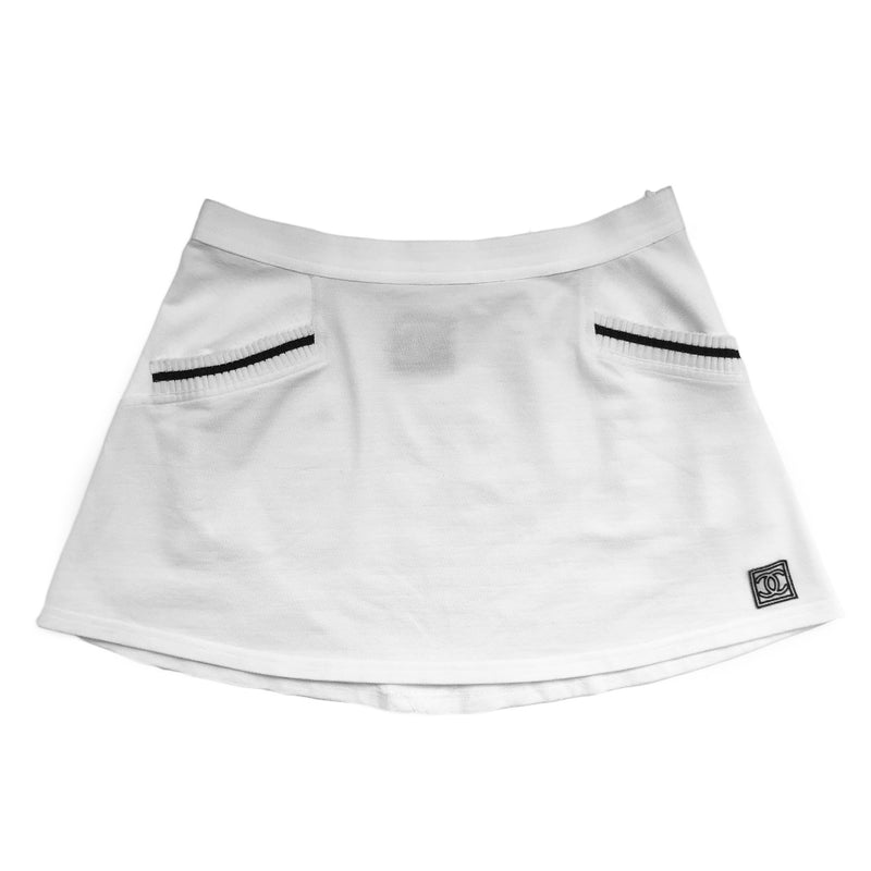 Chanel white tennis skirt, black accents on rib knit front pockets, pique polo fabric, front CC logo